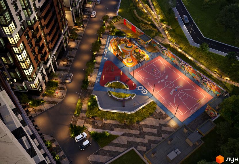 Вигляд зверху на Житловий комплекс CITY HUB з багатоповерхівками та облаштованим подвір'ям з дитячим та спортивним майданчиками.