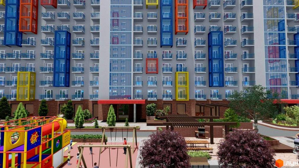Зовнішній вигляд Житлового комплексу Калейдоскоп 2 з кольоровими балконами. На передньому плані дитячий майданчик та зона відпочинку.