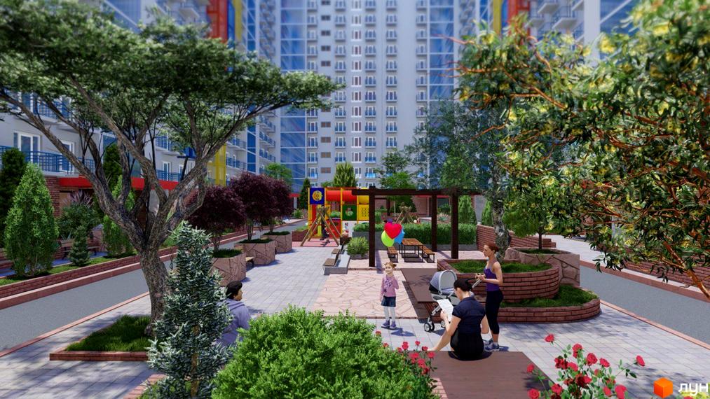 Житловий комплекс Калейдоскоп 2 з дитячим майданчиком та місцями для відпочинку. Архітектура житлового комплексу з великими вікнами та просторими балконами.