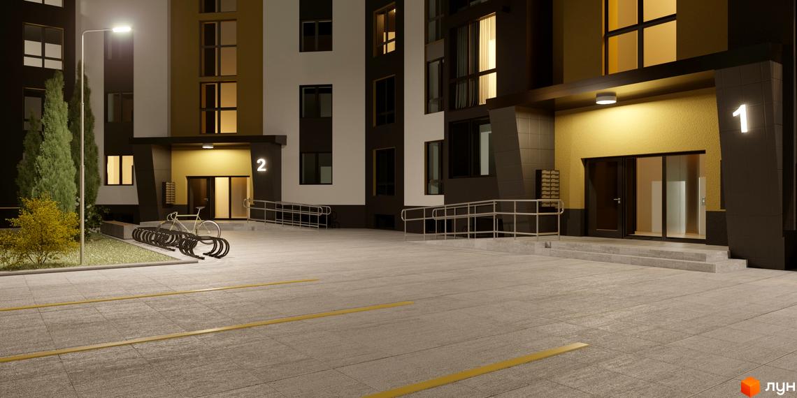 Зовнішній вигляд новобудови ЖК Затишний вночі з підсвіченими вікнами та вхідною групою. Прибудинкова територія з велопарковкою та освітленням.