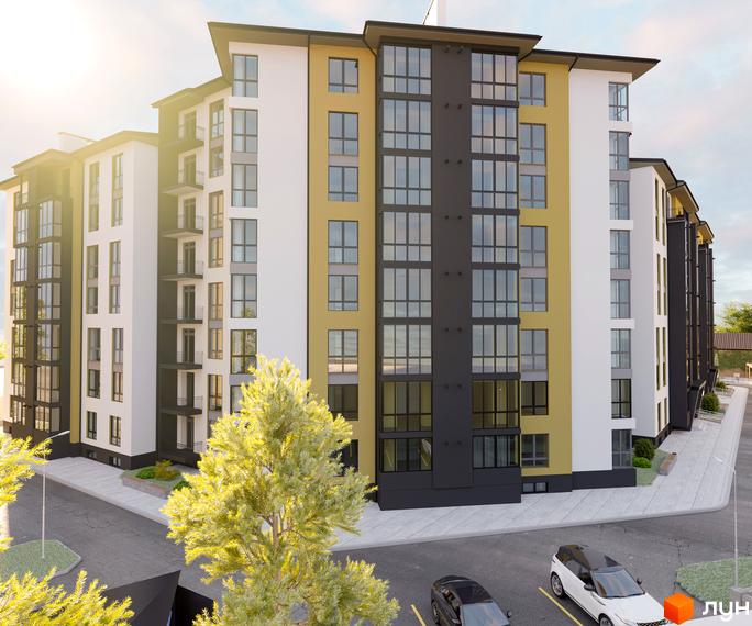 Зовнішній вигляд житлового комплексу Затишний з жовтими та білими фасадами, великими вікнами та балконами. На прибудинковій території видно дерева та припарковані автомобілі.