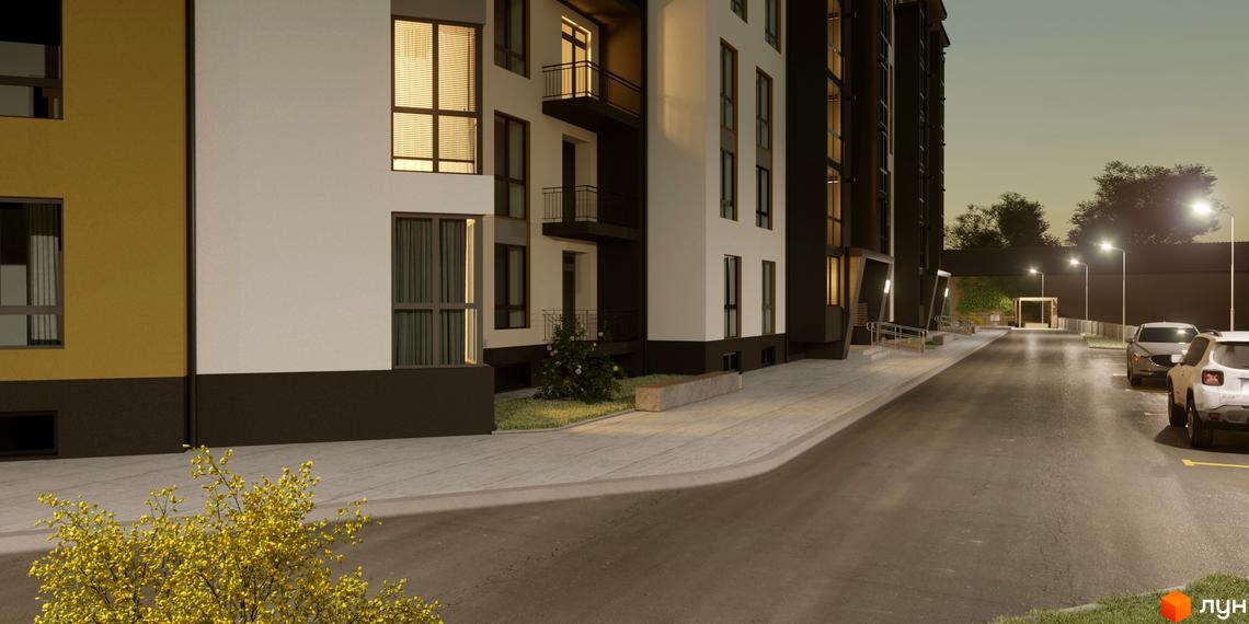 Житловий комплекс Затишний: багатоповерховий будинок з біло-жовтим фасадом. Освітлена прибудинкова територія має дорогу, пішохідну зону та зелені насадження.