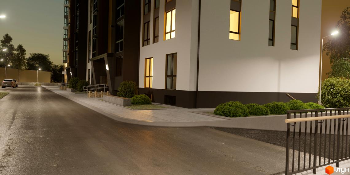 Новобудова Затишний. Будівля з білим та темним фасадом, освітлена вуличними ліхтарями територія з доріжками та зеленими кущами.