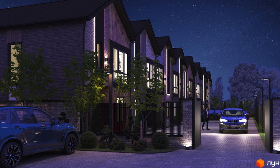 Таунхаус V78 townhouse у вечірній час з підсвіткою фасаду та доглянутою прибудинковою територією з автомобілями.