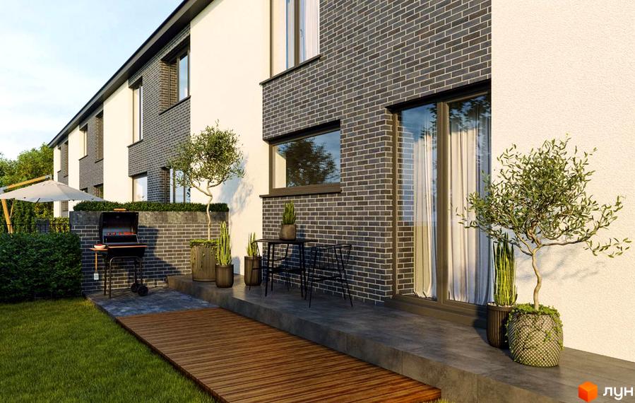 Сучасний житловий комплекс з цегляним фасадом та просторою прибудинковою територією з барбекю та зеленими насадженнями.