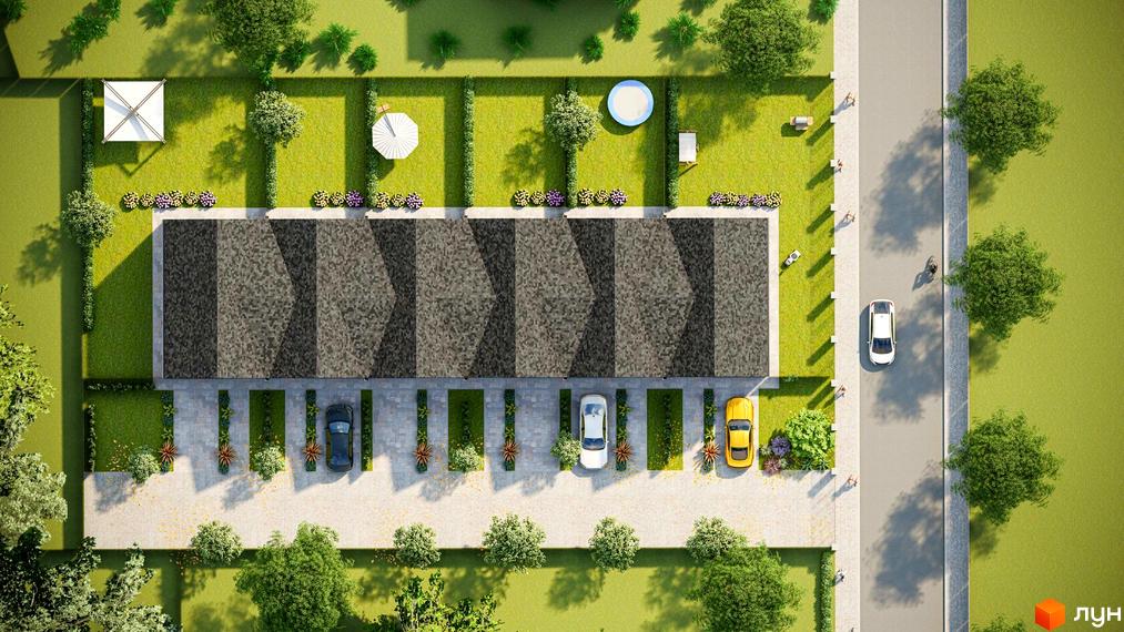 Вид зверху на житловий комплекс на вул. Весняна з низкою будинків та доглянутою прибудинковою територією з газонами та деревами.