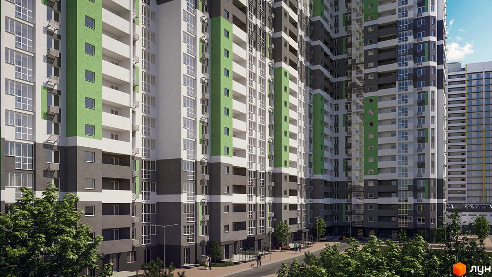 Зовнішній вигляд житлового комплексу Голосіївська Долина з зеленими та сірими фасадами. Навколо комплексу розташовані дерева та вулиця з пішоходами.