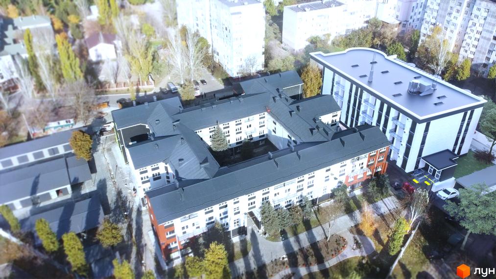 Парк Стоун - житловий комплекс з біло-чорними фасадами та зеленими дахами, розташований серед дерев. На території комплексу є парковка та зелені зони.