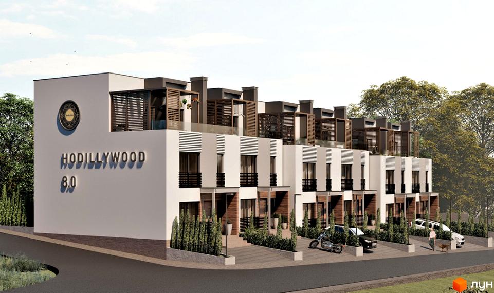 Таунхауси Hodillywood 8.0 - фасади будівель з дерев'яними елементами та балконами, прибудинкова територія з автомобілями та мотоциклом.