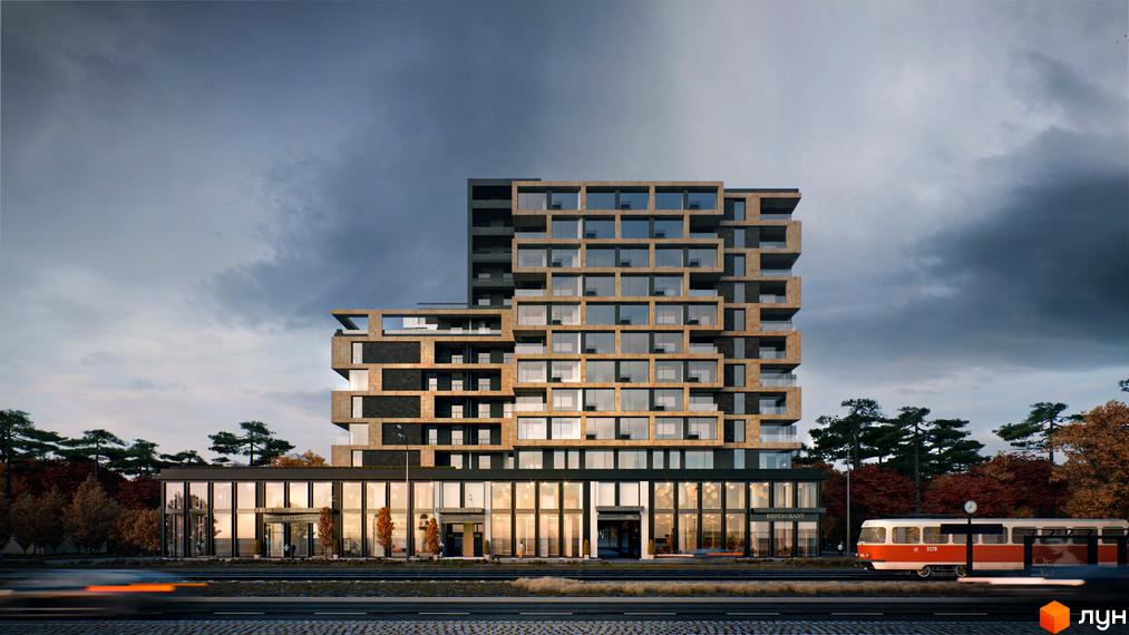 Житловий комплекс PUSHA HOUSE: багатоповерхова будівля з фасадом з блоків та великими вікнами. Поруч дорога з трамваєм та осінні дерева.