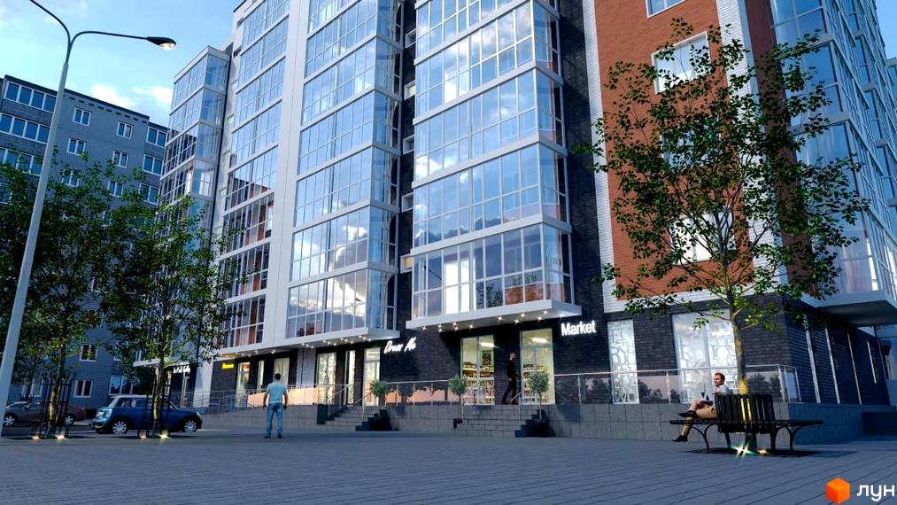 Зовнішній вигляд новобудови ЖК Сімейний з великою кількістю скляних фасадів та прибудинковою територією з деревами та лавками.