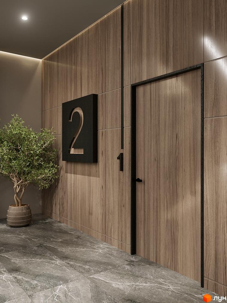 Інтер'єр холу в ЖК Globus Elite 2 з дерев'яними панелями, дверима та рослиною в горщику. На стіні табличка з номером квартири.