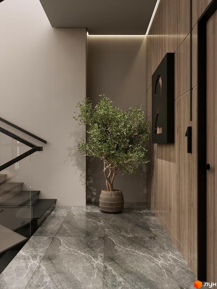 Холл житлового комплексу Globus Elite 2 з мармуровою підлогою, деревом на стінах та декоративним вазоном з рослиною.
