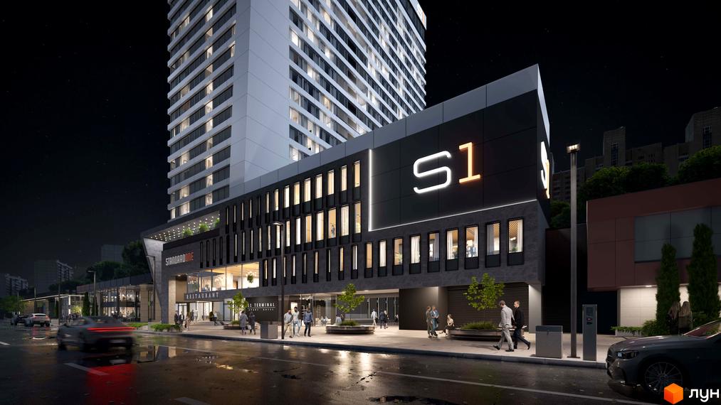 Апарт-комплекс Standard One Terminal з фасадом з темних панелей та великою вивіскою