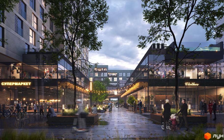 Житловий комплекс Cinematic: фасади будівель з великими вікнами, торговими приміщеннями на першому поверсі та затишною пішохідною алеєю з деревами та освітленням.