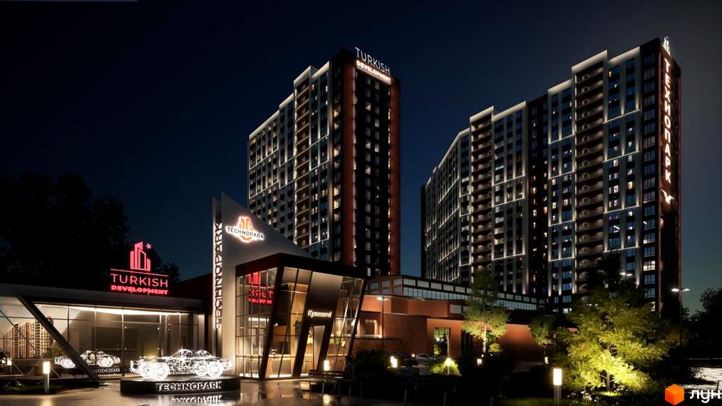 Нічний вигляд на Житловий комплекс Технопарк: два висотні будинки з підсвіченими фасадами та освітлена прибудинкова територія з інсталяціями.