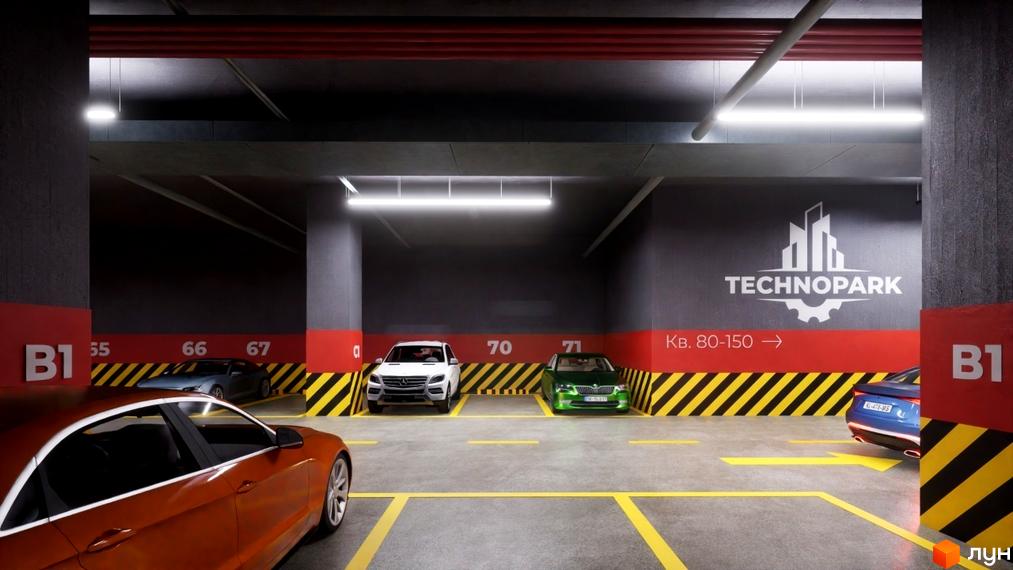 Підземний паркінг Житлового комплексу Технопарк з розміткою місць та вказівниками. На стіні логотип Технопарк.