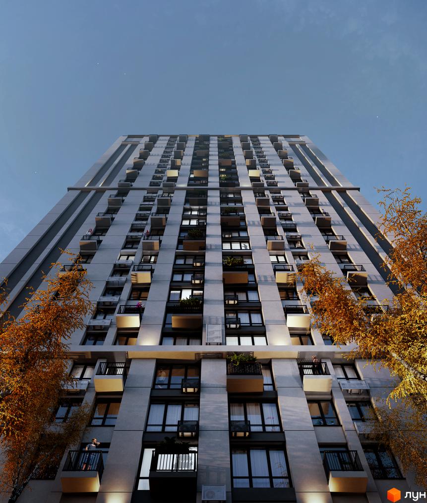 Апарт-комплекс Морська резиденція – висотна будівля з балконами та великими вікнами, оточена деревами з осіннім листям.