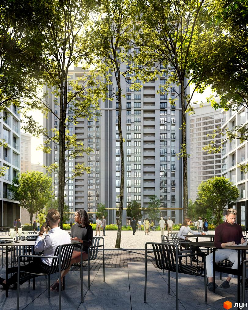Апарт-комплекс Морська резиденція з високими будинками та зеленою прибудинковою територією, де розташовані столики та люди відпочивають.
