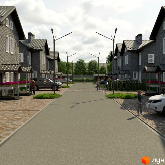 Котеджне містечко КМ GREENBOR. Фотографія вулиці з цегляними будинками, припаркованими автомобілями та зеленими насадженнями.