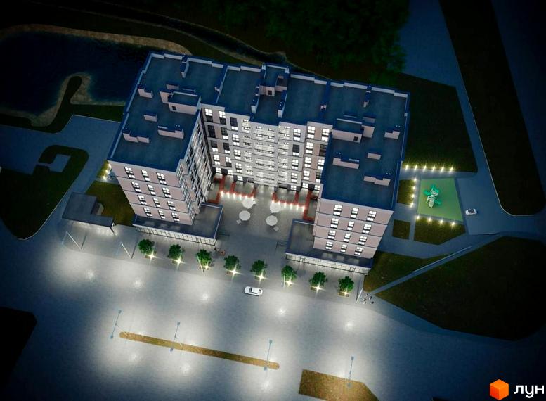 Житловий комплекс Агора: багатоповерховий будинок з освітленими вікнами. Прибудинкова територія має внутрішній двір, дитячий майданчик та озеленення.