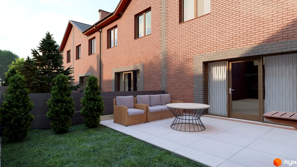 Зображення двоповерхового цегляного будинку в Котеджному містечку Екологічне з терасою та ландшафтним дизайном. Навколо зелений газон та декоративні дерева.