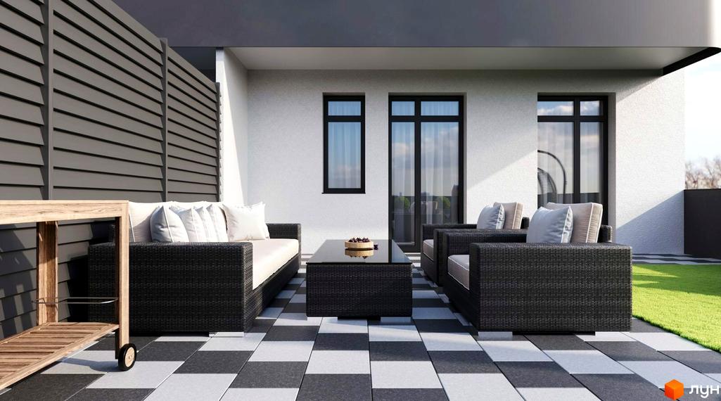 Зображення тераси з плетеними меблями у Житловому комплексі San Marco. На задньому плані біла стіна з вікнами та зелений газон.