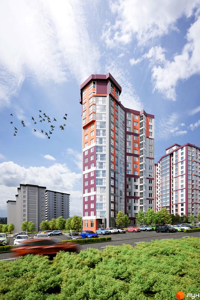 Житловий комплекс Варшавський мікрорайон з яскравим фасадом та автомобілями на парковці. Навколо багато зелені та хмарне небо.