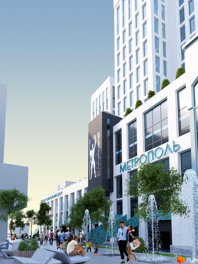 Зображення фасаду Житлового комплексу Метрополь та прибудинкової території з фонтанами. На передньому плані люди.