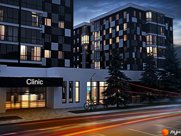 Зовнішній вигляд новобудови ЖК Union з фасадом у шаховому порядку та підсвіченими вікнами. Територія біля будинку з деревами та дорогою з відблисками фар.