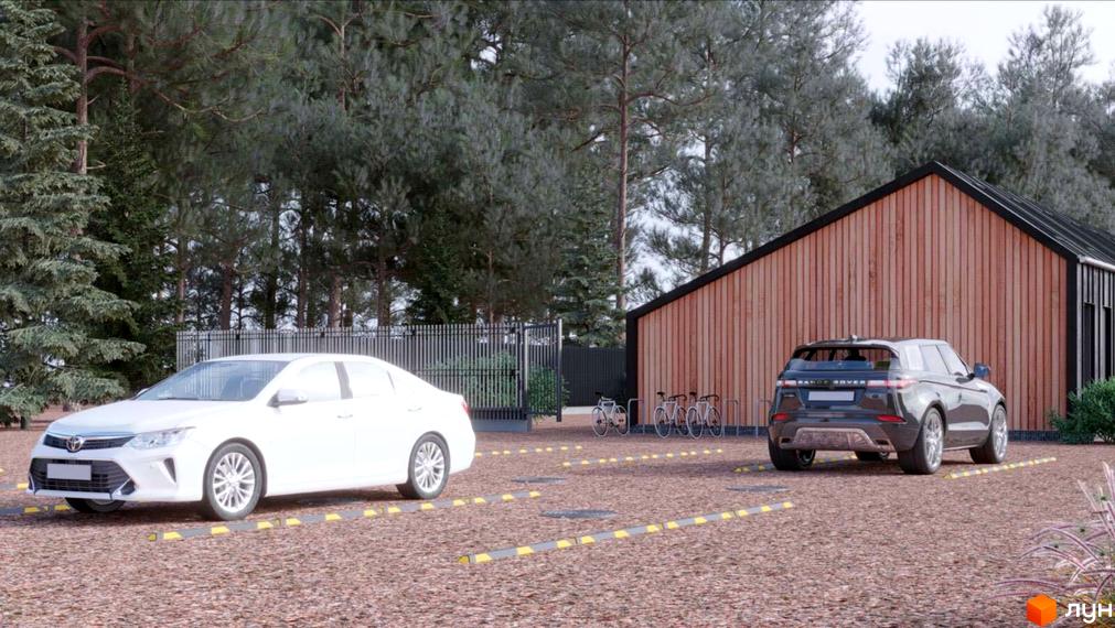 Зображення житлового комплексу Lbd1. На території комплексу розташовані будинки з дерев'яним фасадом, поруч припарковані автомобілі.