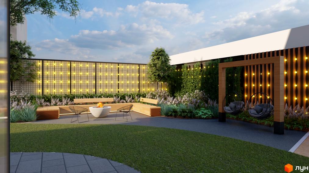 Житловий комплекс OKRUZHNA HALL має фасад з білими елементами та облаштований двір з вогнищем, лавами та підвісними кріслами. Територія прикрашена декоративним освітленням.