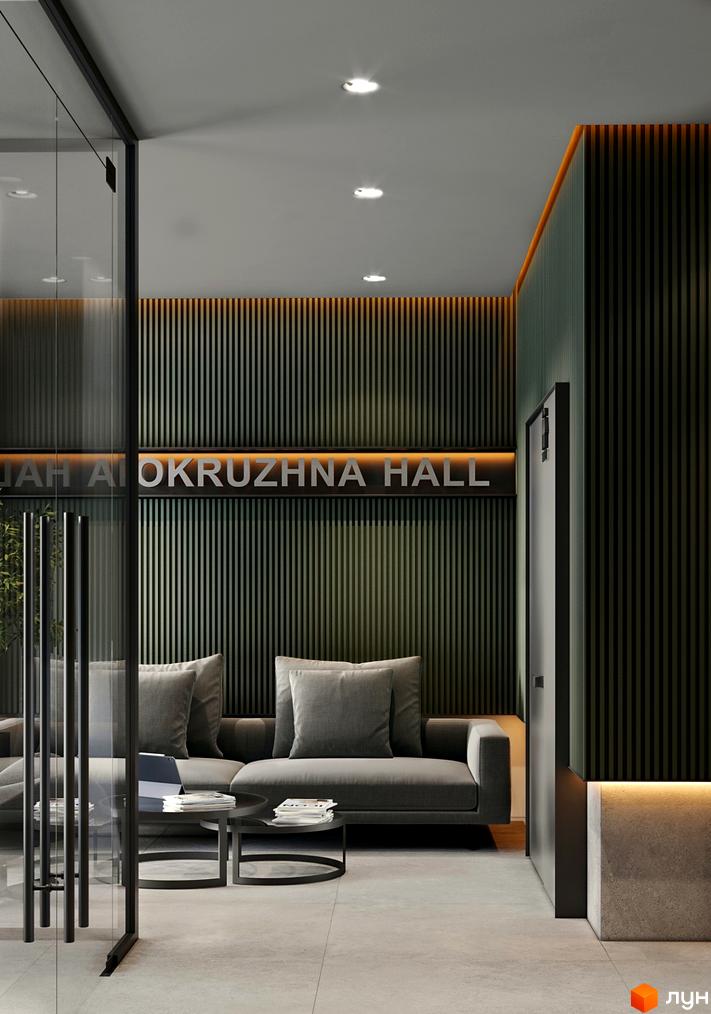 Інтер'єр ЖК OKRUZHNA HALL: просторий хол з диванами та столиками, оздоблений панелями з підсвічуванням. Скляні двері та світла підлога створюють відчуття простору.
