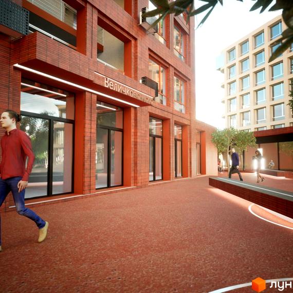 Зображення фасаду Житлового комплексу на Величковського з червоної цегли. На передньому плані пішохідна зона з людьми.