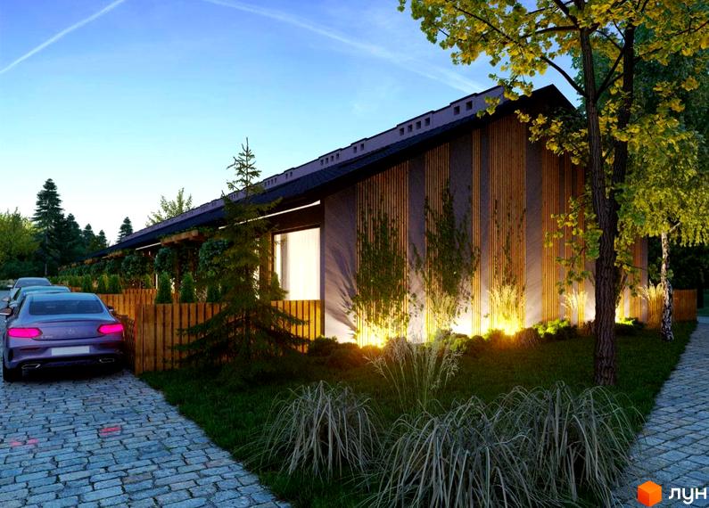 Таунхауси Harmony Land з дерев'яним фасадом та підсвіткою, оточені зеленими насадженнями та парканом. Прибудинкова територія з вимощеною доріжкою та автомобілями.