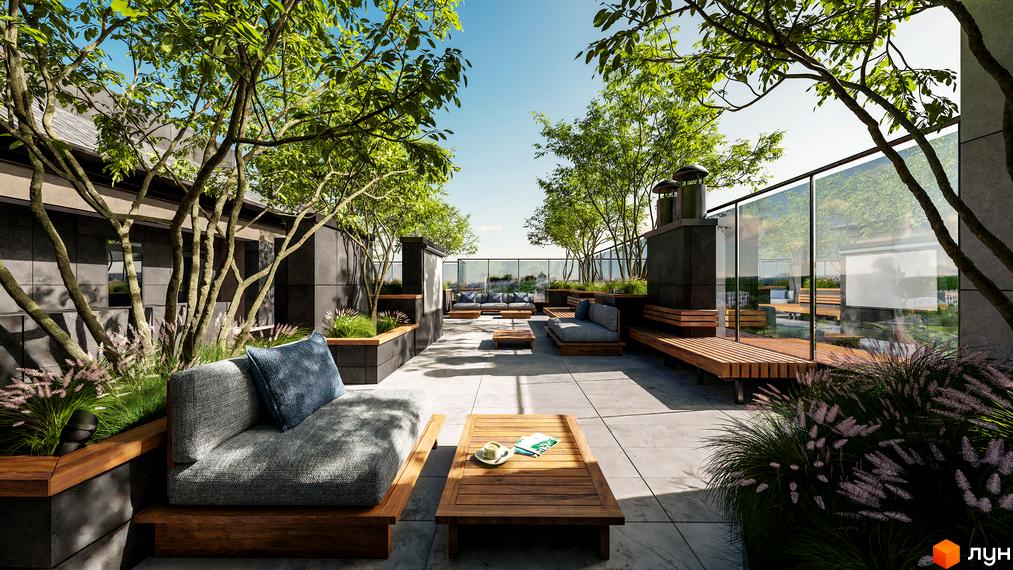 Зображення тераси на даху Житлового комплексу Замкова Брама з м'якими меблями та деревами. Вигляд на внутрішній дворик.