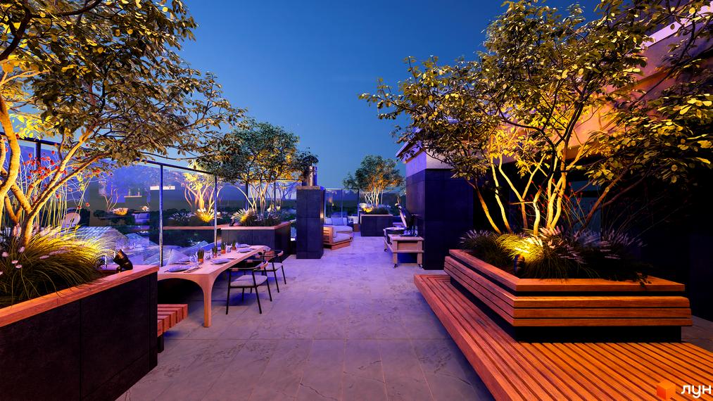 Зображення тераси на даху Житлового комплексу Замкова Брама з деревами у великих вазонах та місцем для відпочинку.