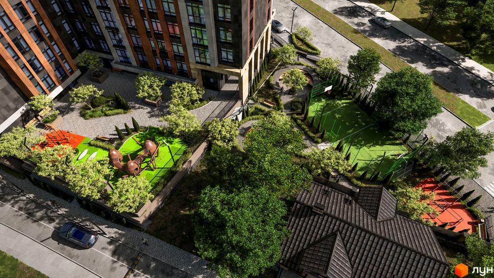 Вид зверху на Житловий комплекс Замкова Брама з облаштованою прибудинковою територією, де є дитячий та спортивний майданчики.