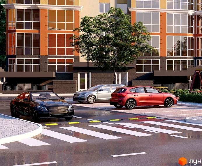 Житловий комплекс Еней з великими вікнами та паркуванням біля будинку. На території комплексу є зелені насадження та пішохідний перехід.