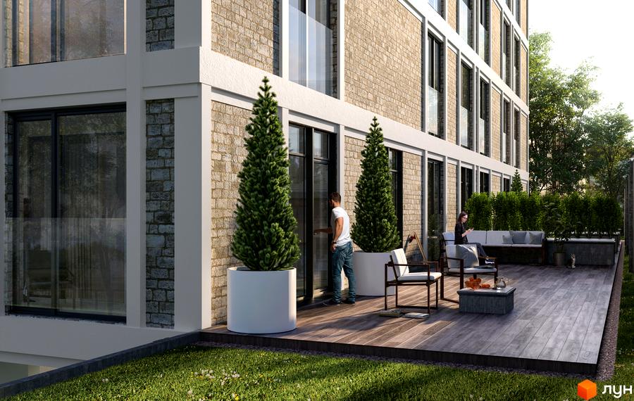 Житловий комплекс Вілла Погулянка з фасадом з цегли та великими вікнами. На прибудинковій території розташовані зелені насадження та зона відпочинку.