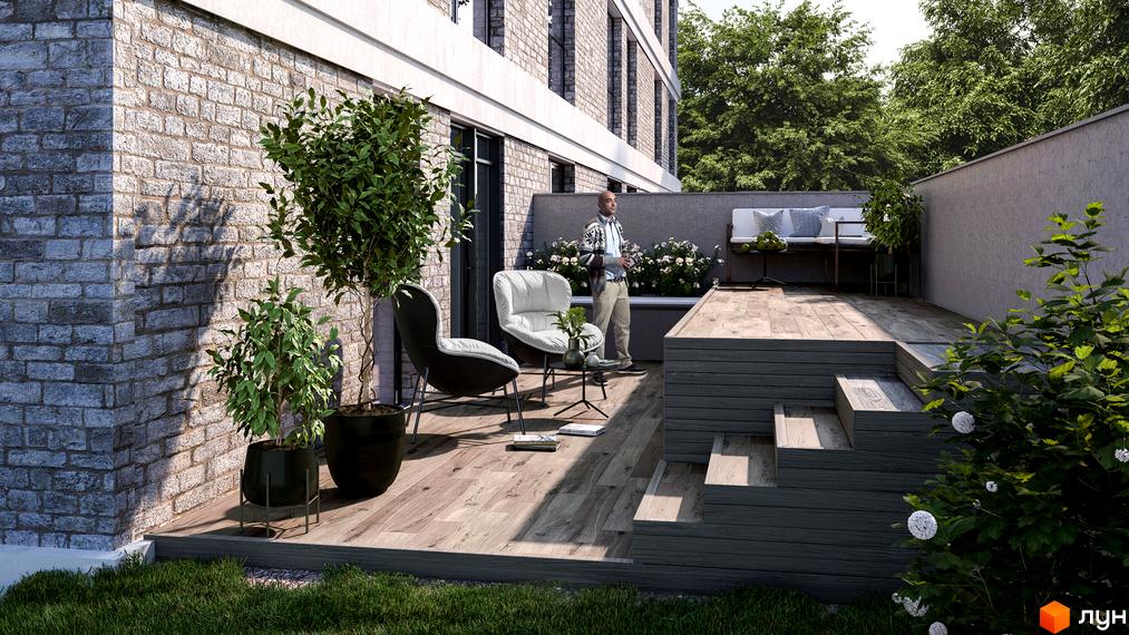 Житловий комплекс Вілла Погулянка: цегляний фасад будинку та затишна тераса з дерев'яним настилом, меблями та рослинами. Відкрийте для себе комфортне життя у новобудові.