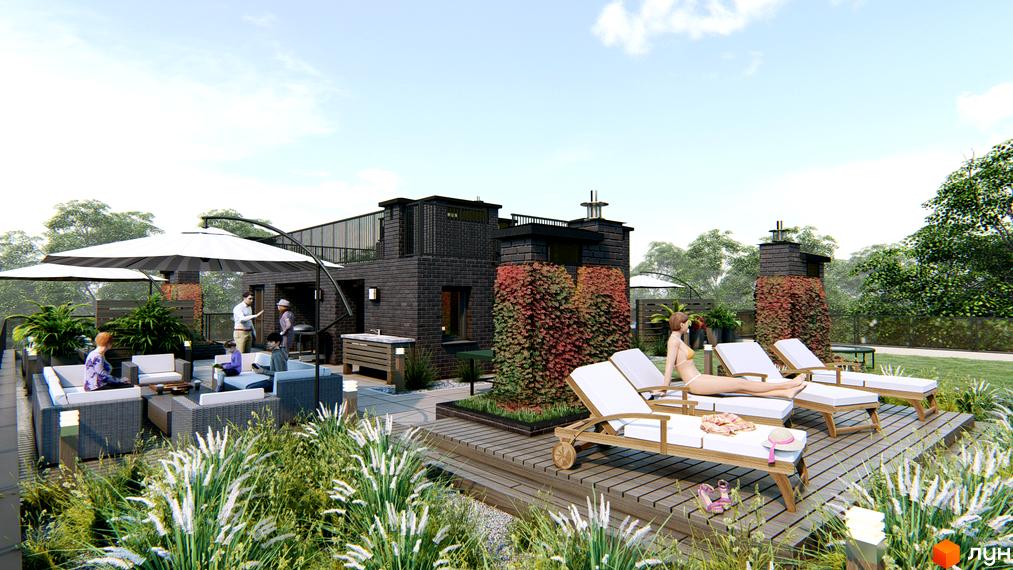 Житловий комплекс Озера Йозефа: цегляний будинок з терасою на даху та облаштованою зоною відпочинку.