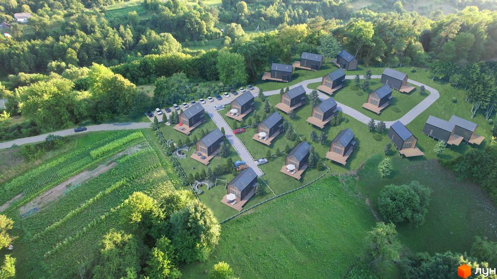 Котеджне містечко Схили: сучасні будинки з дерев'яними терасами та зеленою прибудинковою територією.