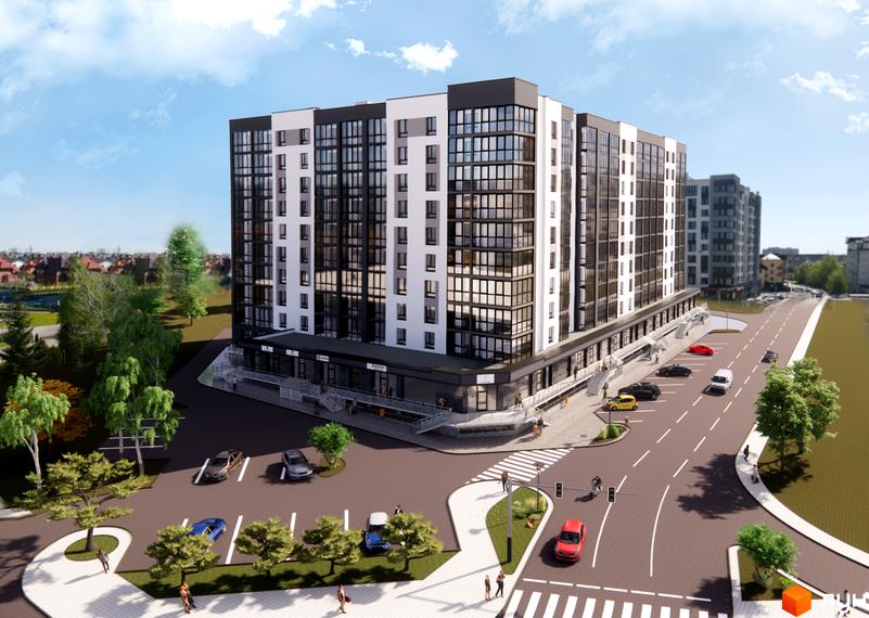 Сучасний житловий комплекс Comfort House з біло-чорним фасадом та великими вікнами, розташований біля дороги з прибудинковою територією та зеленими насадженнями.