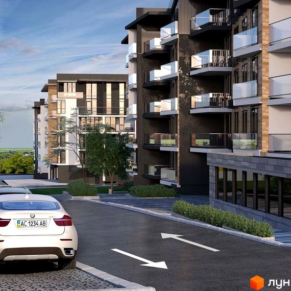Житловий комплекс Традиція з фасадами темного кольору та скляними балконами. Навколо будинку облаштована прибудинкова територія з дорогою та зеленими насадженнями.