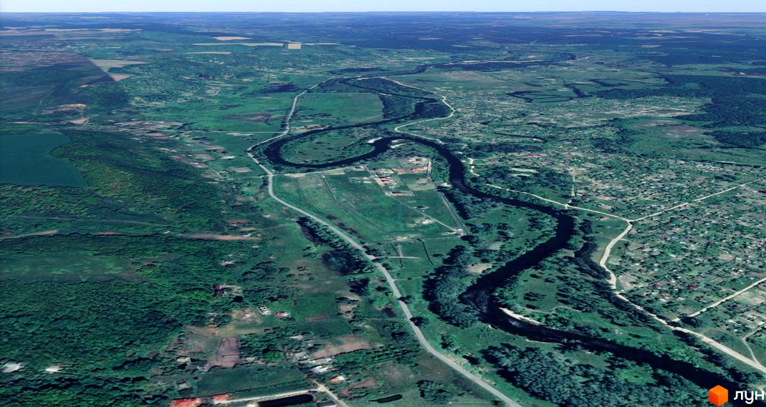 Котеджне містечко Лужок: вид з висоти пташиного польоту на мальовничі краєвиди з річкою та зеленою територією.