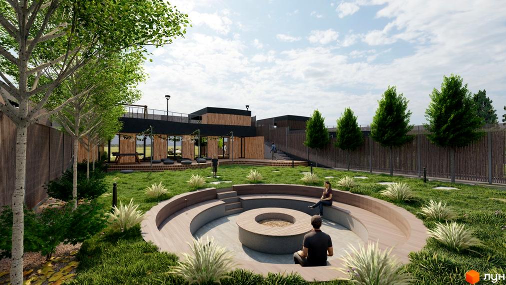 Котеджне містечко KRAIEVYD: сучасний дизайн будівель та затишна прибудинкова територія з місцем для відпочинку біля вогнища.