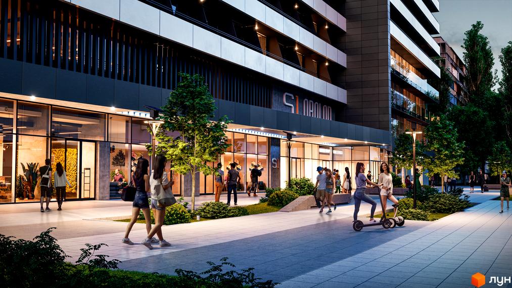 Зображення фасаду Новобудови Standard One Obolon з великими вікнами та прибудинковою територією з пішохідною зоною.