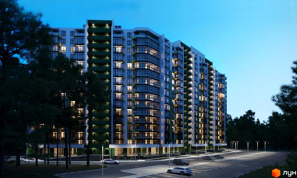 Зовнішній вигляд житлового комплексу Київські Зорі-2 з підсвіченими вікнами та балконами, парковка та дерева навколо.