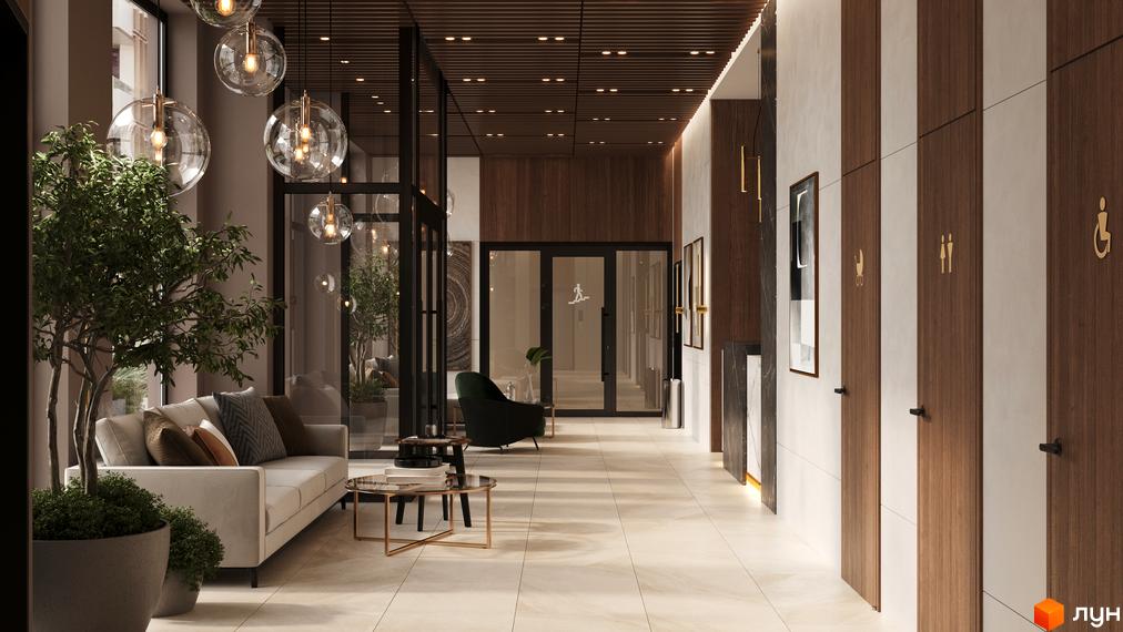 Лобі житлового комплексу SYMBOL з диваном, рослинами та дверима з піктограмами.